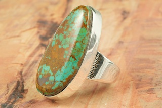 Genuine Crow Springs Turquoise set in Sterling Silver Ring. The Crow Springs Mine is located near Tonopah, Nevada. Created by Navajo Artist Phillip Sanchez. Signed.
